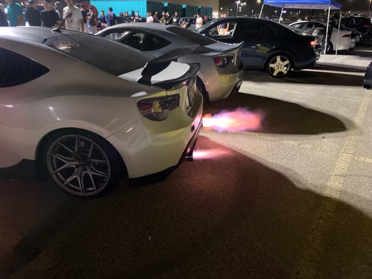 Night meet cars shooting flames